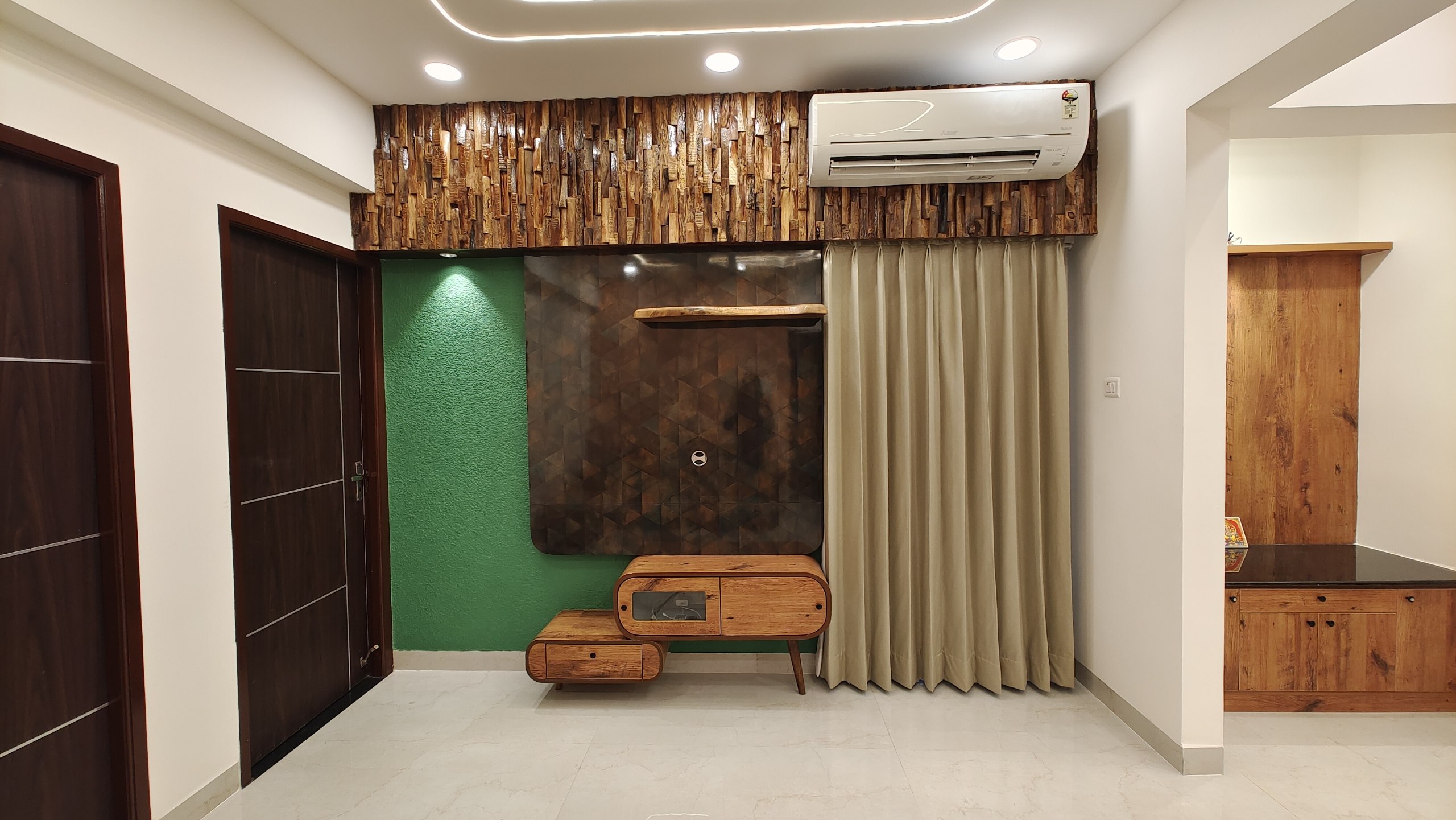 Modern luxury TV unit and feature wall design in Chennai by Interiors360